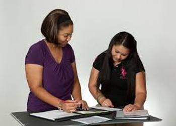 Female mentor working with female mentee