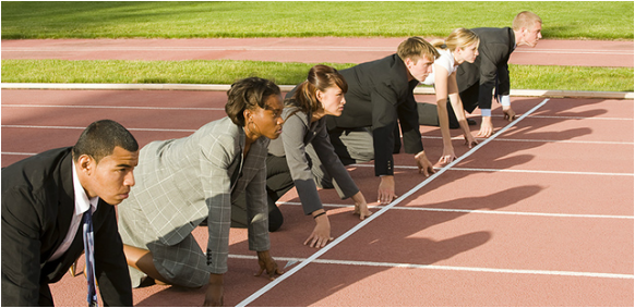 Business people at a track's starting line